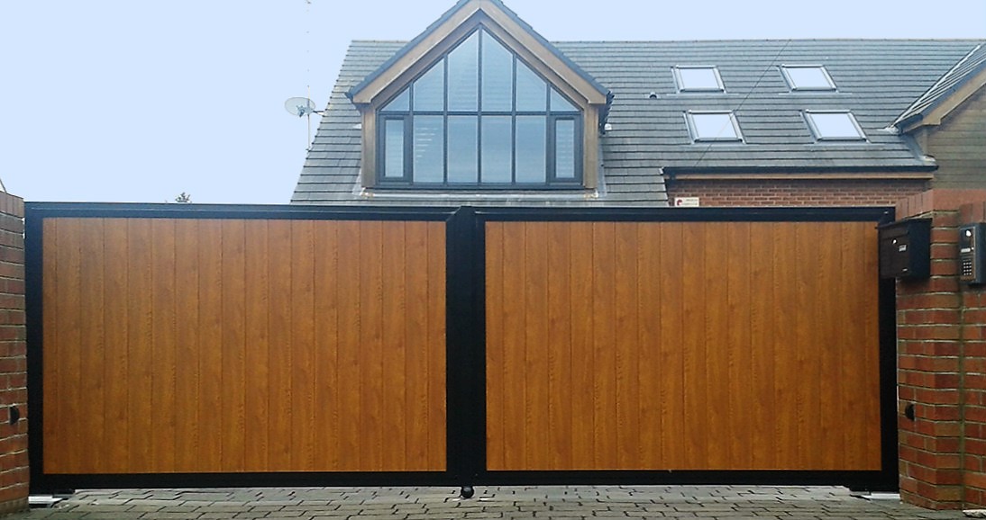 Sliding gate designed to look like swing gates